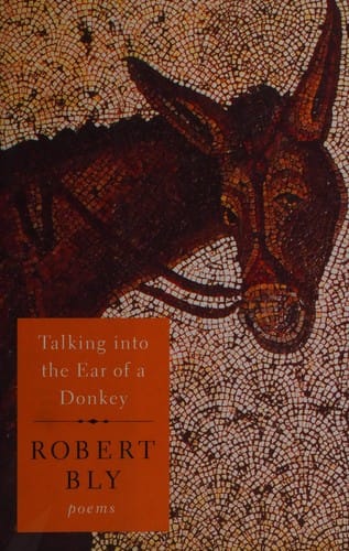 Talking into the ear of a donkey