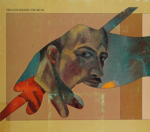 The hand holding the brush