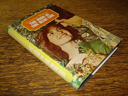 The man in the blue car