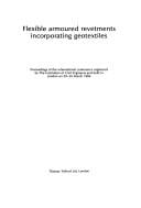 Flexible armoured revetments incorporating geotextiles