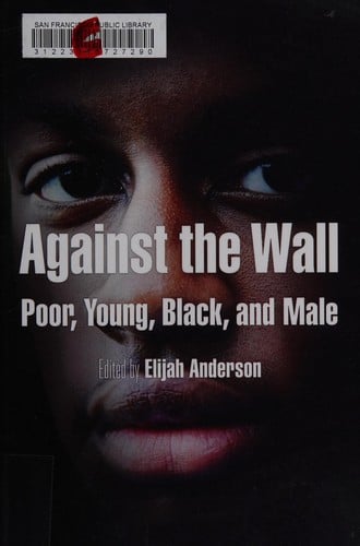 Against the wall